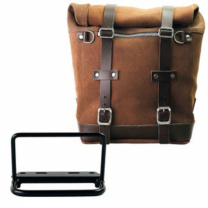 A brown canvas roll-top bag with dark brown leather straps and silver buckles, shown with a black metal mounting bracket on a white background. 